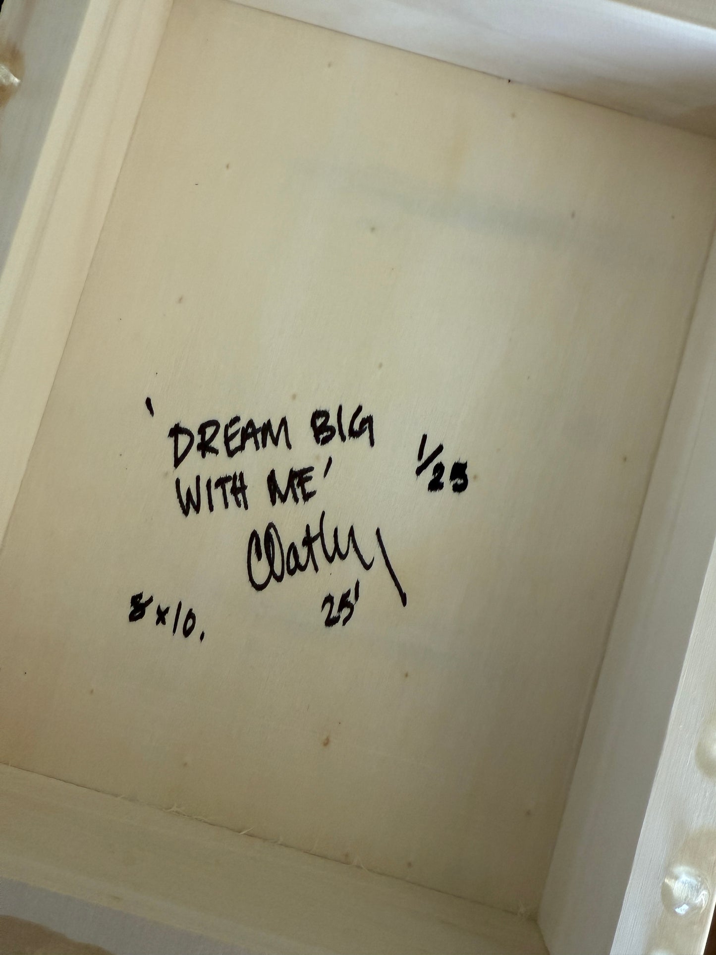 Back of 'Dream Big With Me' limited edition artwork by Christen Oatley, hand-signed, numbered 1/25, and labeled 8x10 inches on Canadian birchwood panel, verifying the authenticity of this resin-coated mixed media piece.