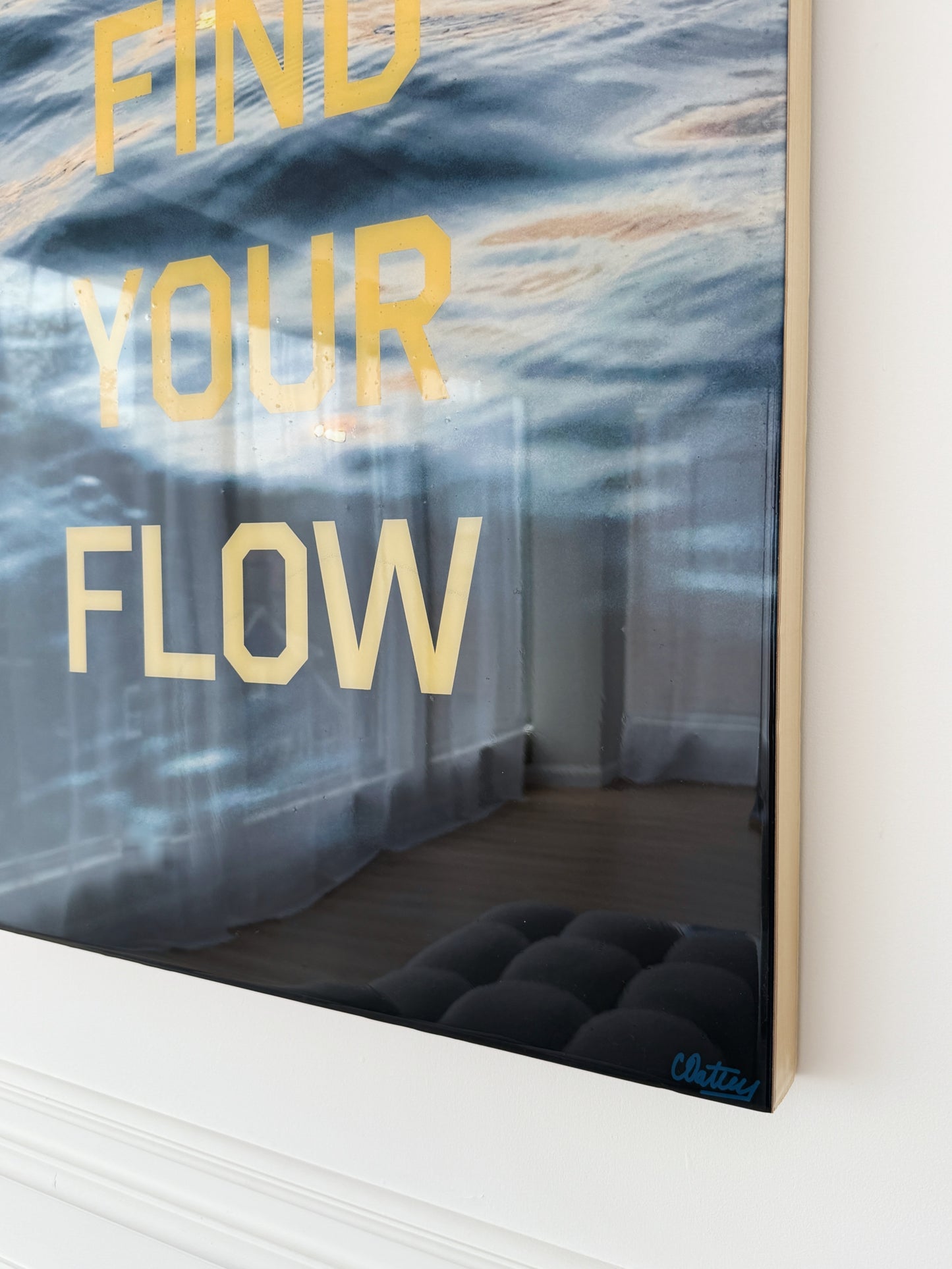 Side profile: Find Your Flow – Sunset' original mixed media artwork by Christen Oatley, featuring moody Lake Joseph sunset photography with bold yellow screen-printed text, created on a 24x30 inch birchwood panel with a glossy resin finish.