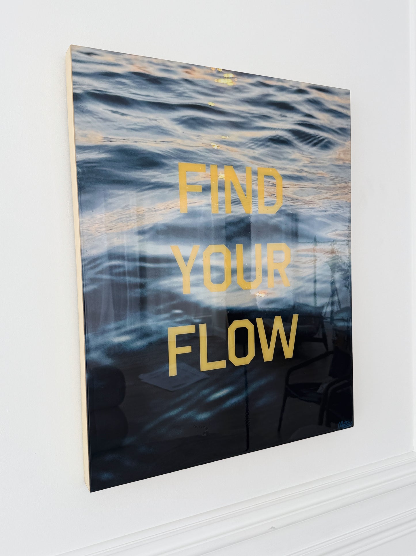 Side View: Find Your Flow – Sunset' original mixed media artwork by Christen Oatley, featuring moody Lake Joseph sunset photography with bold yellow screen-printed text, created on a 24x30 inch birchwood panel with a glossy resin finish.