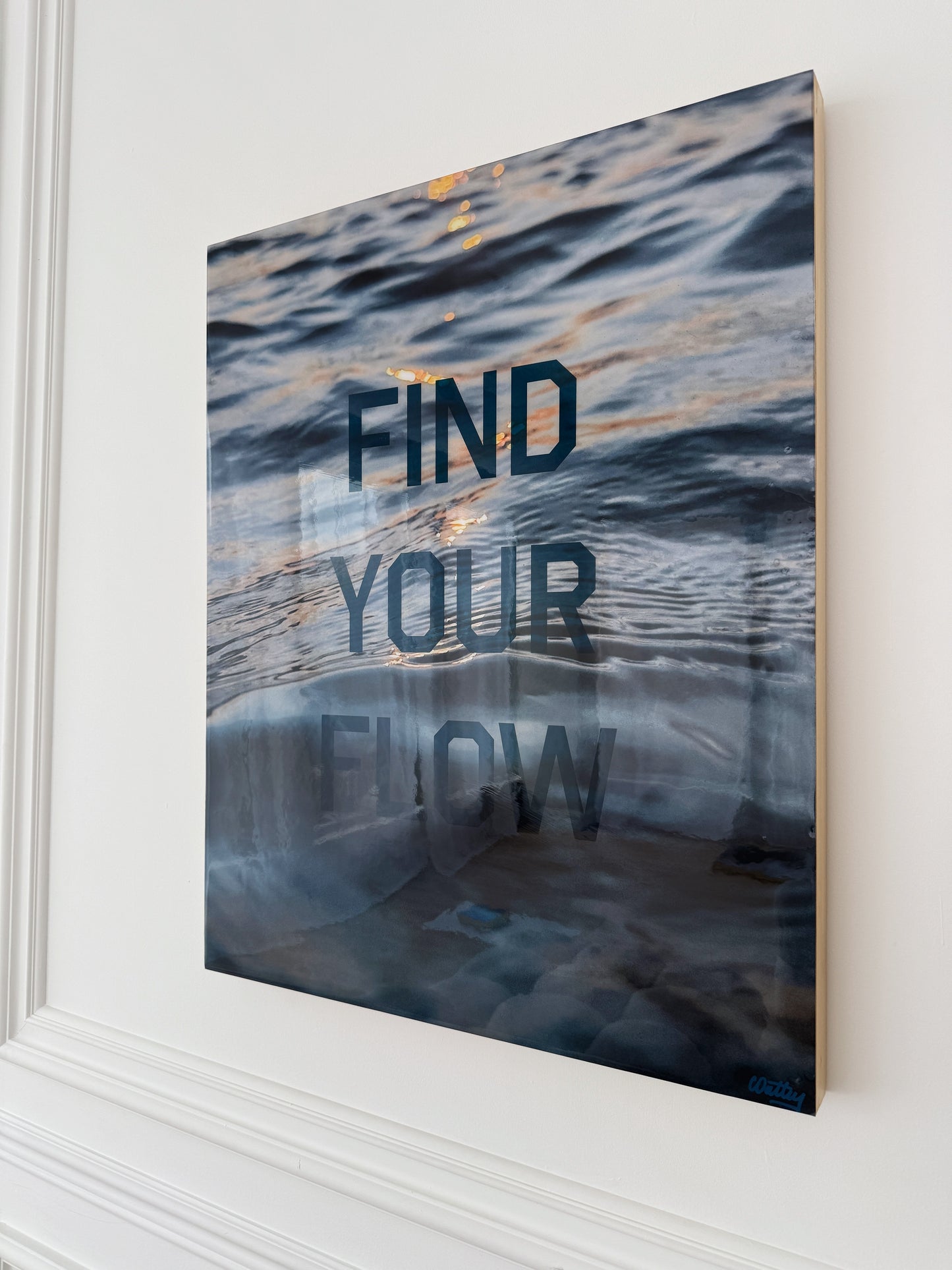 Side view: 'Find Your Flow – Dusk' original mixed media artwork by Christen Oatley, featuring a Muskoka sunset over Lake Joseph with translucent navy screen-printed text on photography, finished with resin on a 24x30 inch Canadian birchwood panel.
