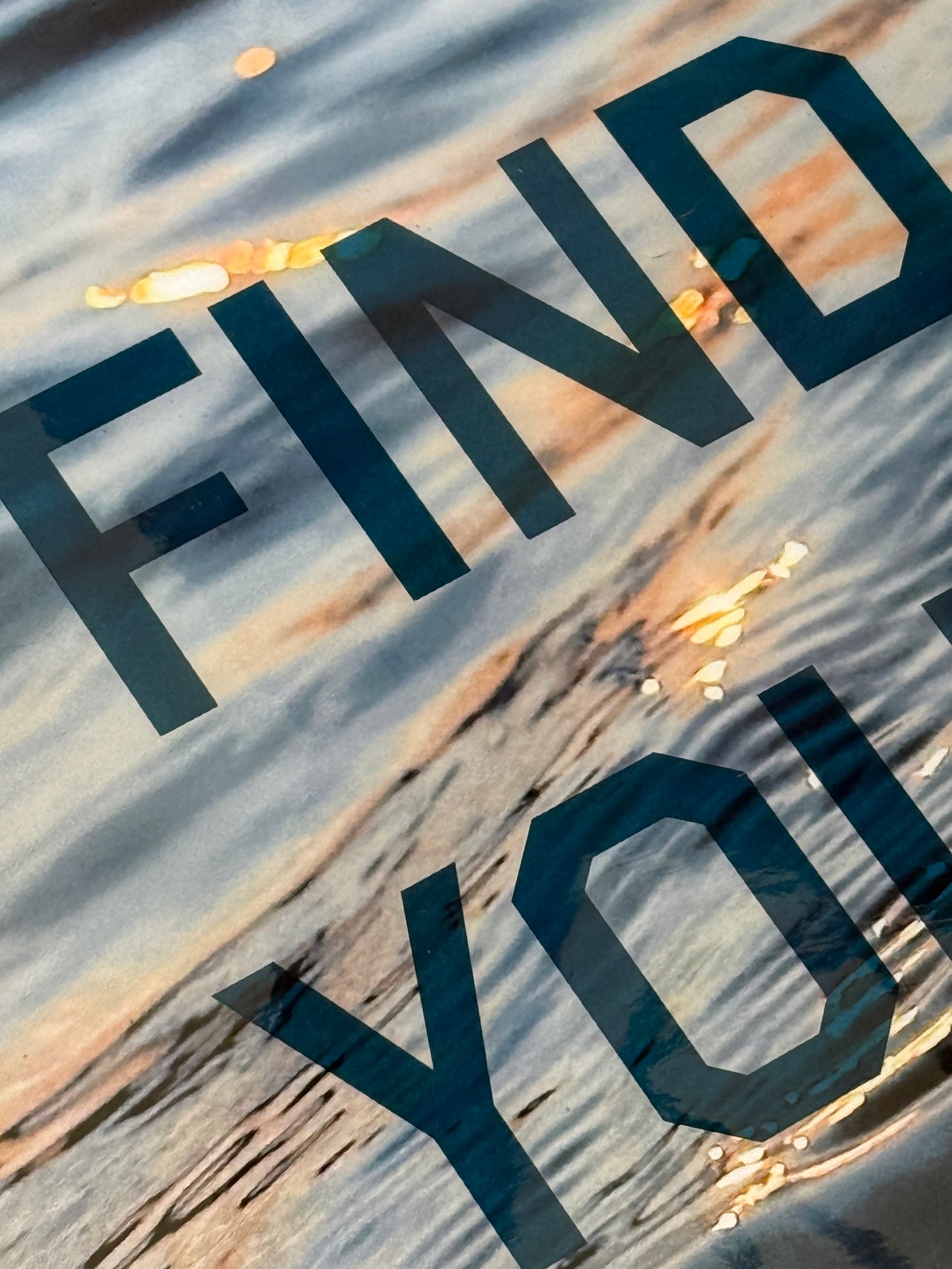 Close up: 'Find Your Flow – Dusk' original mixed media artwork by Christen Oatley, featuring a Muskoka sunset over Lake Joseph with translucent navy screen-printed text on photography, finished with resin on a 24x30 inch Canadian birchwood panel.