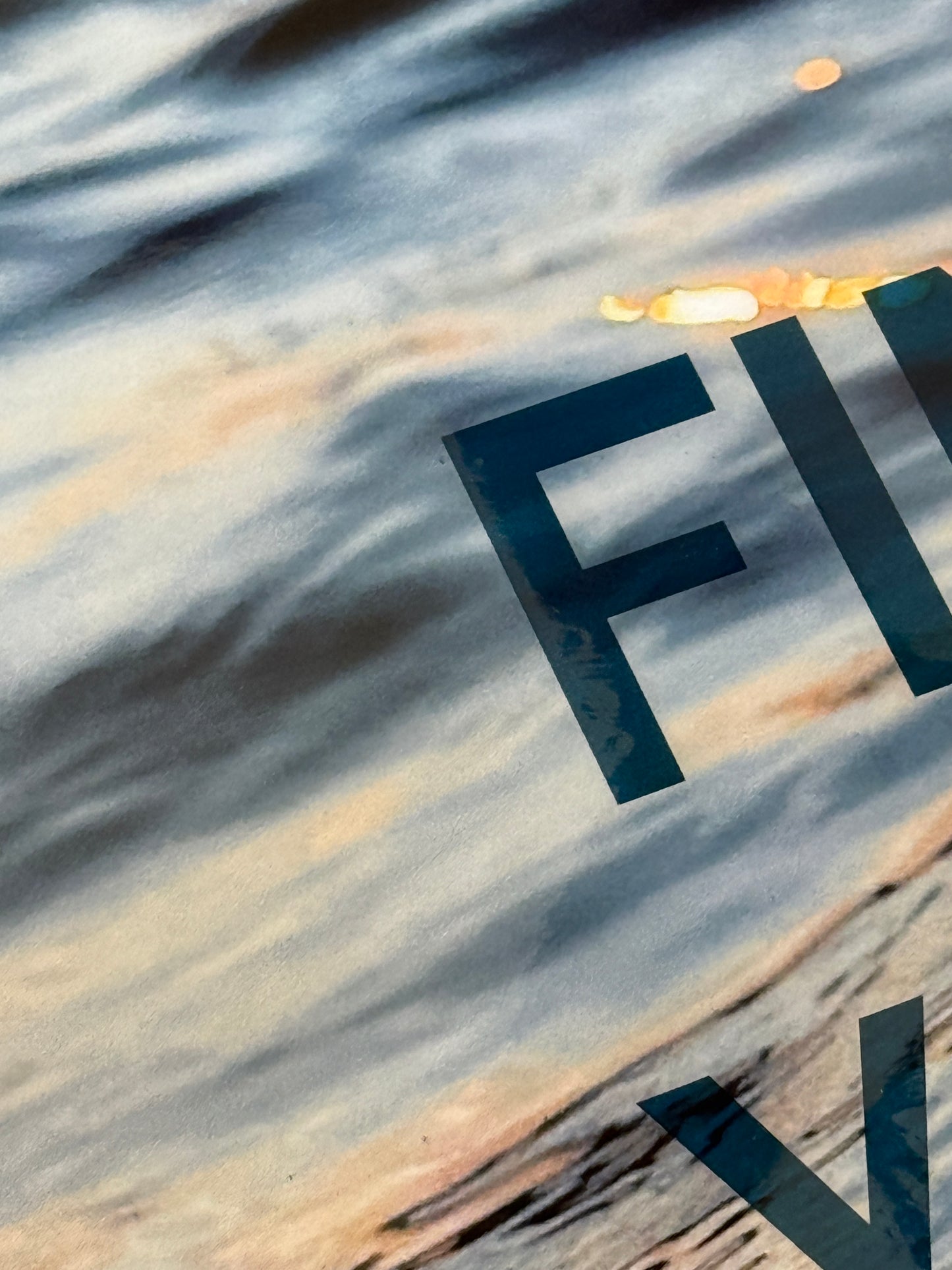 Close up: 'Find Your Flow – Dusk' original mixed media artwork by Christen Oatley, featuring a Muskoka sunset over Lake Joseph with translucent navy screen-printed text on photography, finished with resin on a 24x30 inch Canadian birchwood panel.