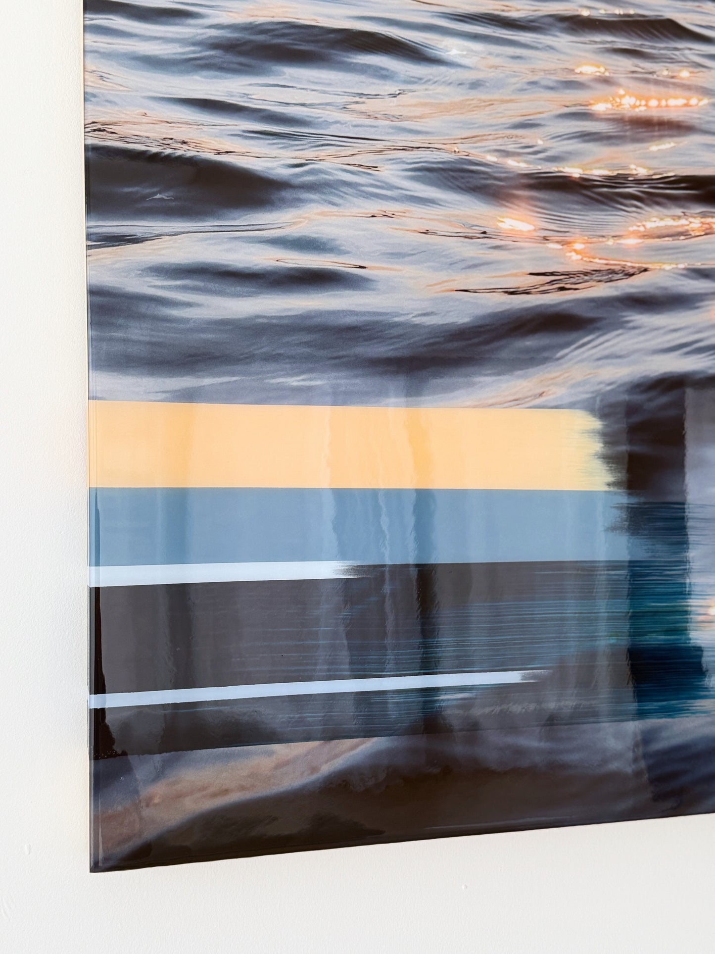 Close-up of 'Sunset Tones' original mixed media artwork by Christen Oatley, showing layered acrylic and oil brushstrokes over a Lake Joseph sunset photograph, finished with a glossy resin coat on birchwood panel.