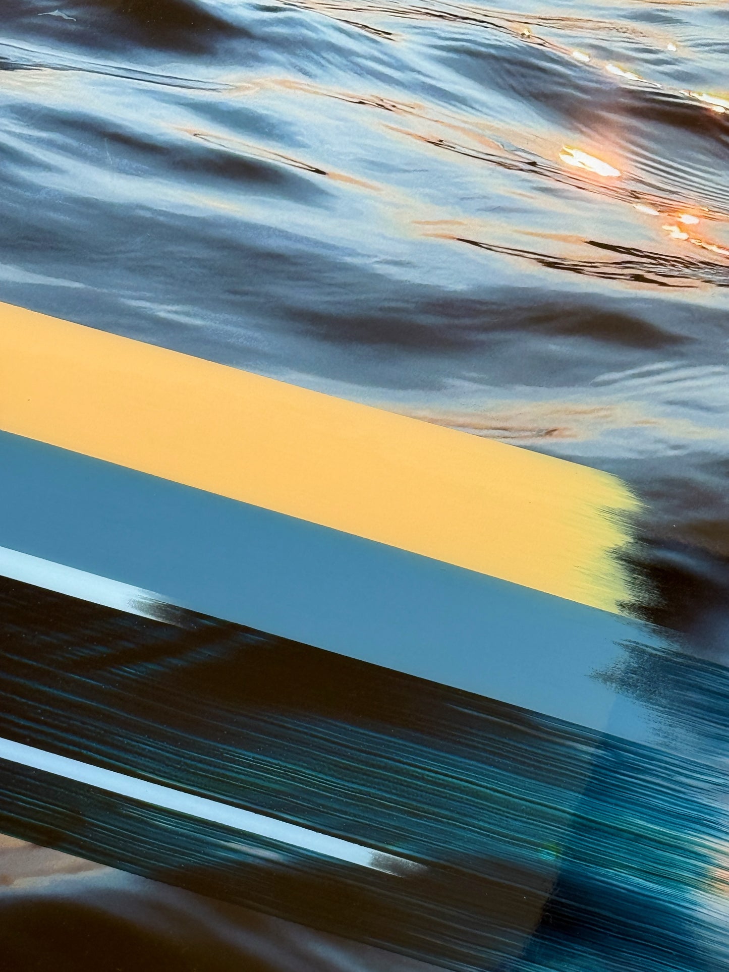 Close-up of 'Sunset Tones' original mixed media artwork by Christen Oatley, showing layered acrylic and oil brushstrokes over a Lake Joseph sunset photograph, finished with a glossy resin coat on birchwood panel.