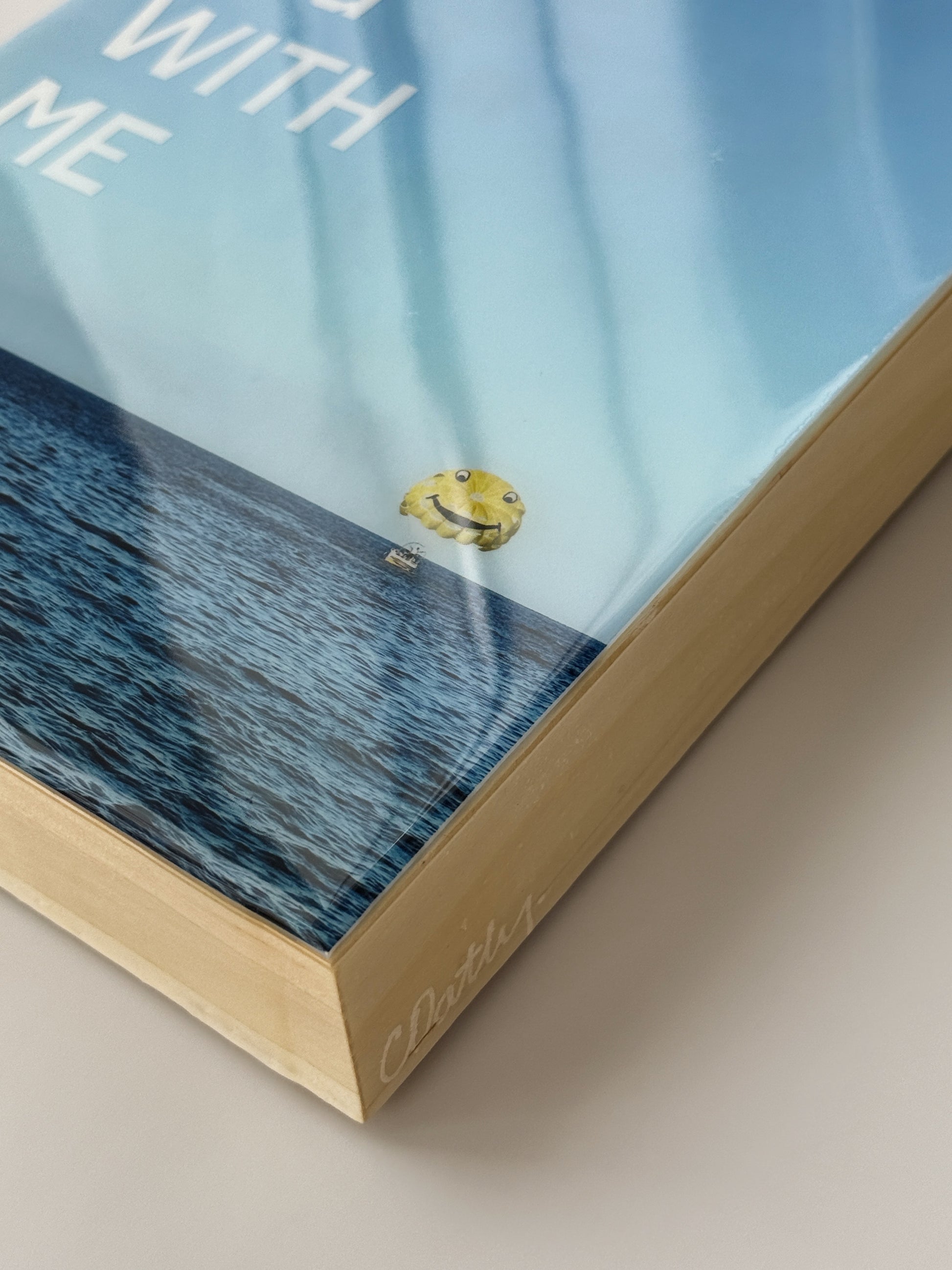Close up: 'Dream Big With Me' limited edition mixed media artwork by Christen Oatley, featuring a yellow parasail over the Mediterranean Sea with bold white acrylic text, created on an 8x10 inch Canadian birchwood panel with resin finish.