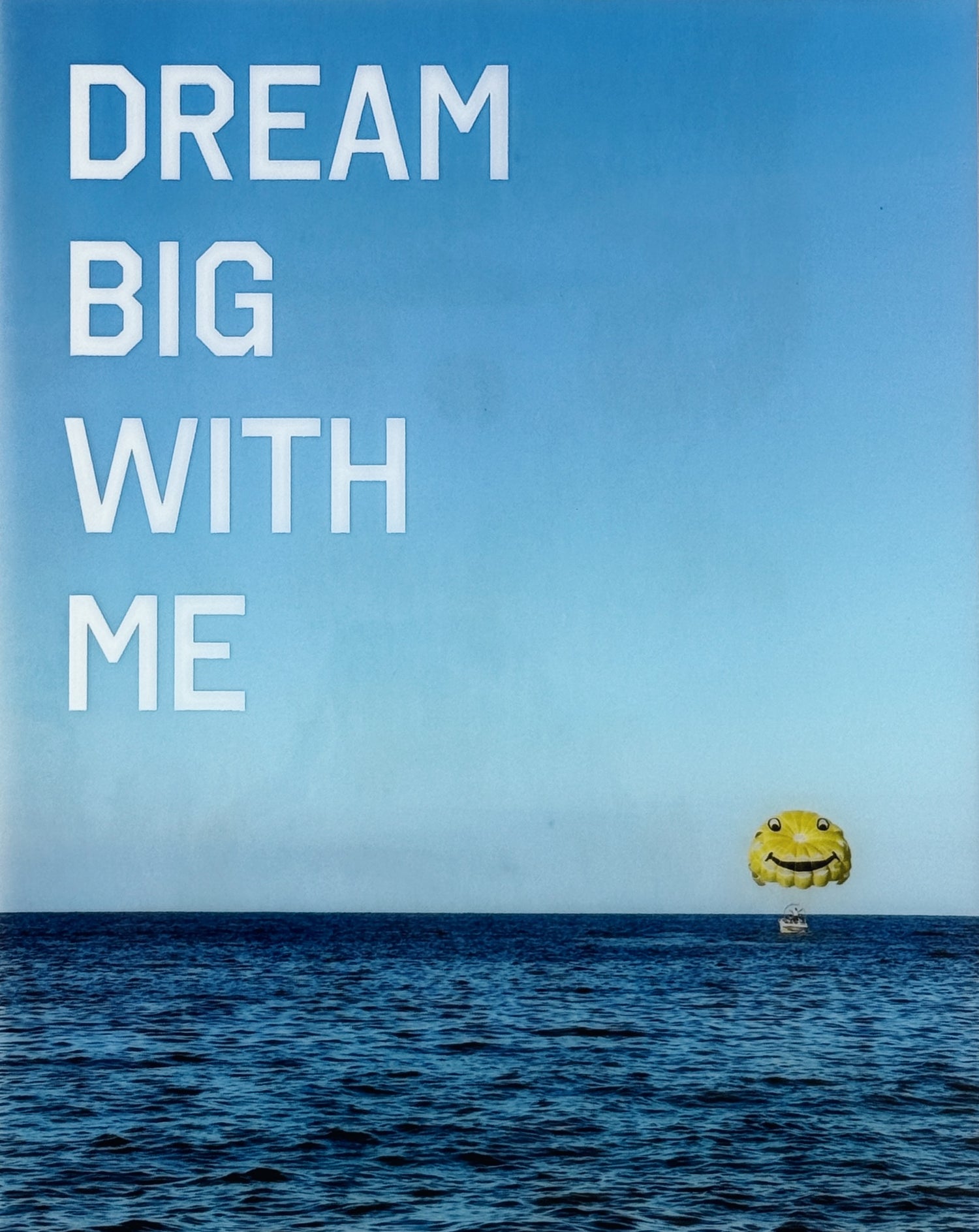 'Dream Big With Me' limited edition mixed media artwork by Christen Oatley, featuring a yellow parasail over the Mediterranean Sea with bold white acrylic text, created on an 8x10 inch Canadian birchwood panel with resin finish.