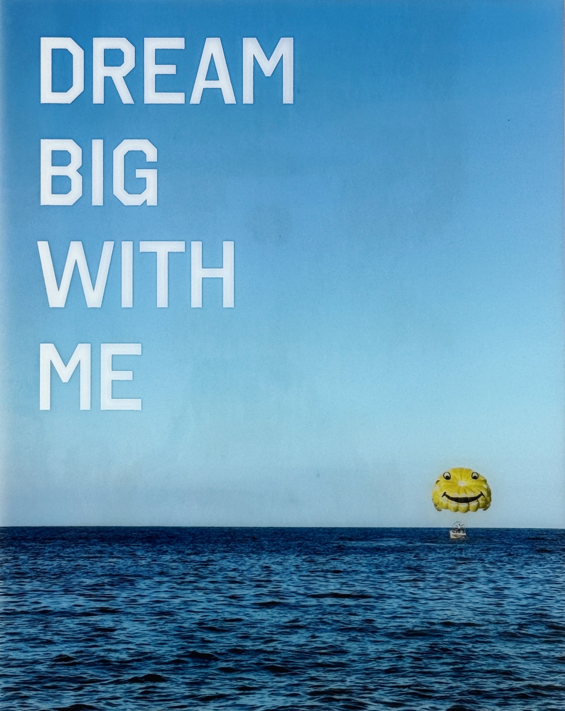'Dream Big With Me' limited edition mixed media artwork by Christen Oatley, featuring a yellow parasail over the Mediterranean Sea with bold white acrylic text, created on an 8x10 inch Canadian birchwood panel with resin finish.